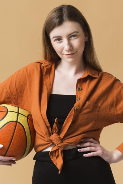 front-view-young-woman-with-basketball-ball